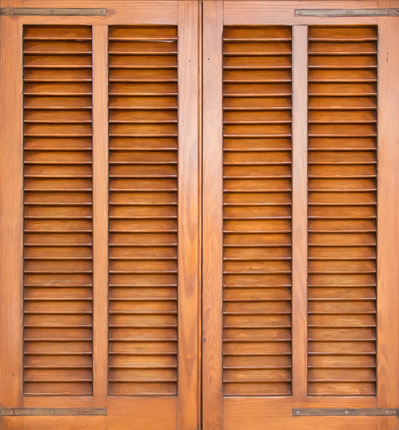 Window with brown shutters. Close-up view. - Photo, Image