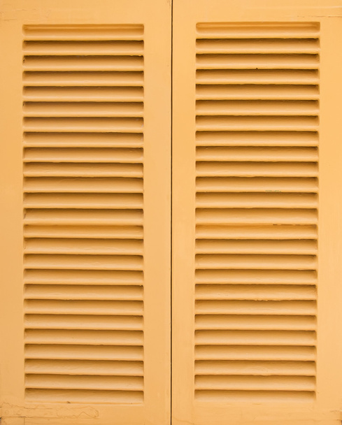 Window with beige shutters. Close-up view. - Photo, Image