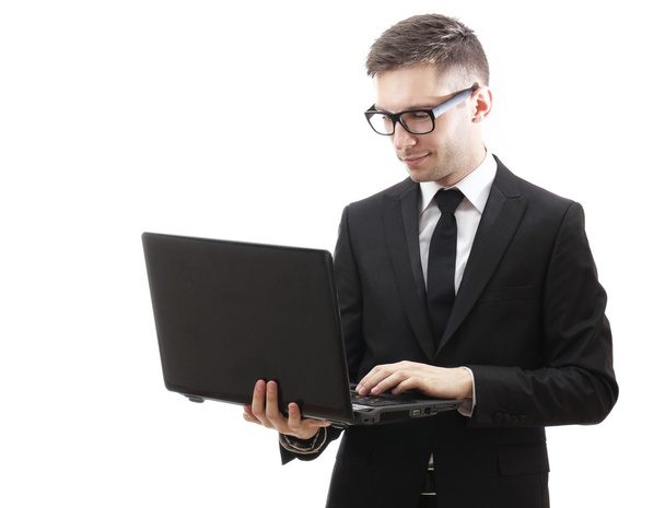 Business man holding a laptop and smiling. - Zdjęcie, obraz