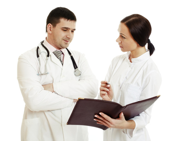 Successful doctors discussing something. - Stock Image - Foto, afbeelding
