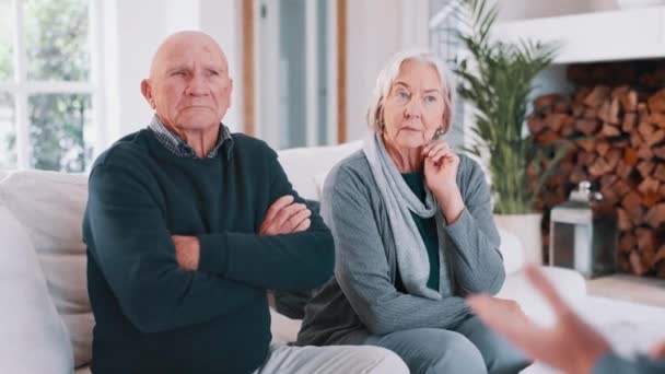 Senior, couple and woman consultation on sofa for retirement budget planning, asset management or paperwork. Old people, meeting and unhappy for pension fund finance or divorce, fight or home stress. - Footage, Video
