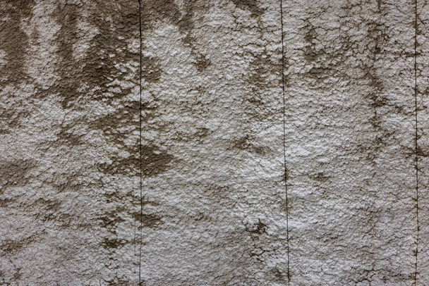 rough concrete wall with weathered texture effect and vertical saw cut slits - Photo, Image