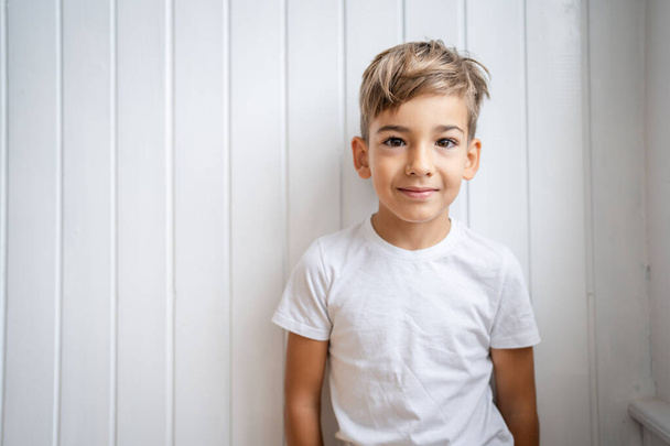 One boy caucasian child seven years old kid at home bright portrait - Photo, Image