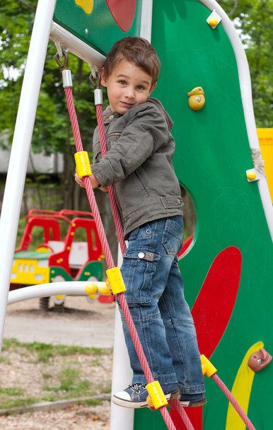 Little boy playing at playground - Photo, image