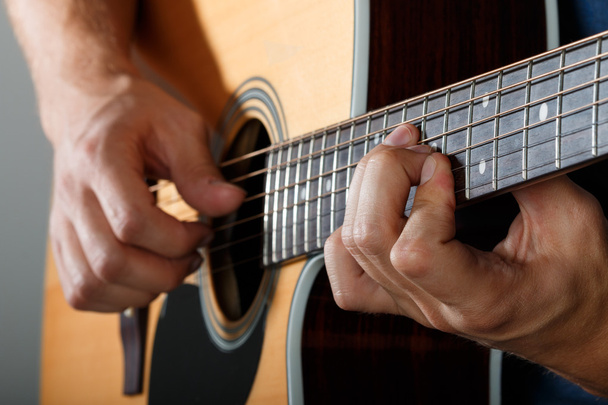 Acoustic guitar player performing song - Φωτογραφία, εικόνα