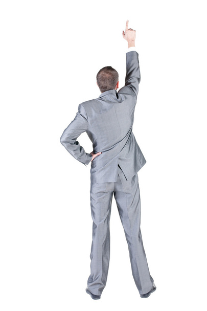 Businessman pointing at wall. rear view. - Photo, Image