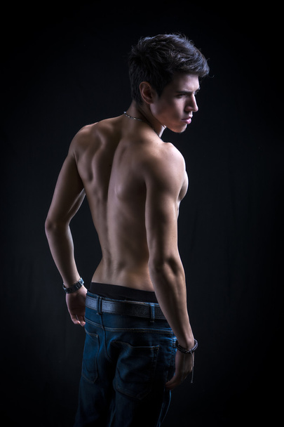 Handsome muscular shirtless young man from the back - Zdjęcie, obraz