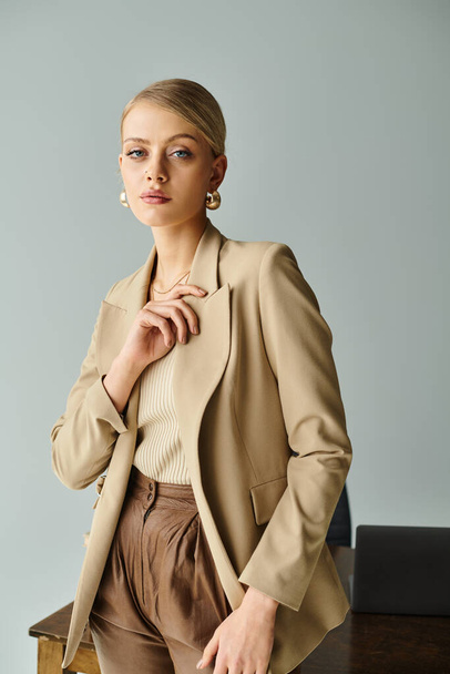 appealing stylish woman with accessories posing alluringly and looking at camera while at office - Photo, Image