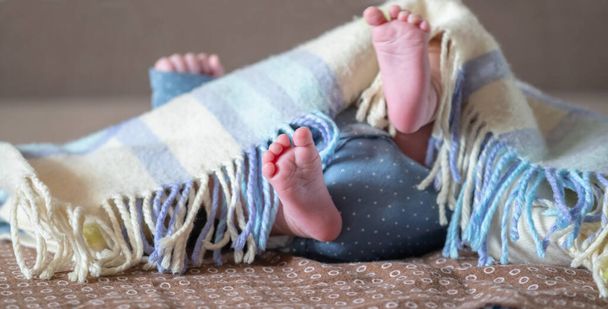 The tiny foot of a newborn baby. Soft feet of a new born. Close up of toes, heels and feet of a newborn. Copy space. - Photo, Image