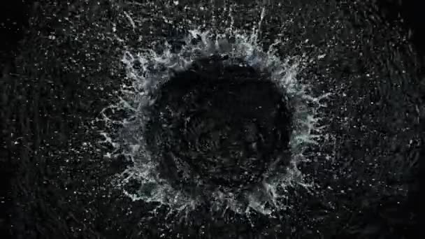 Super Slow Motion Shot of Round Water Splash on Black Background at 1000fps. Filmed with High Speed Cinema Camera, 4K. - Footage, Video