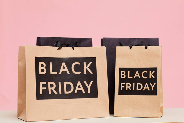 Close-up of Black Friday paperbags on table in shopping store - Fotografie, Obrázek