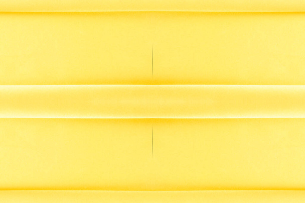 background seamless texture - yellow silk. Premium silk organza in pale yellow is an exceptional fabric, beautiful both on its own and as an accessory in terms of highlighting. - Photo, Image