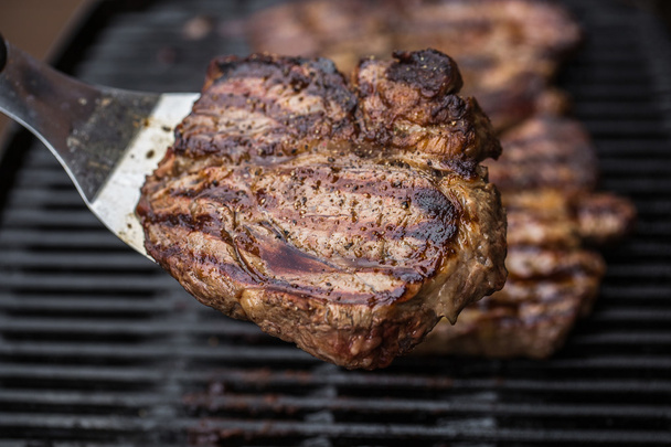 Beef steak on spatula BBQ grilled - Fotó, kép