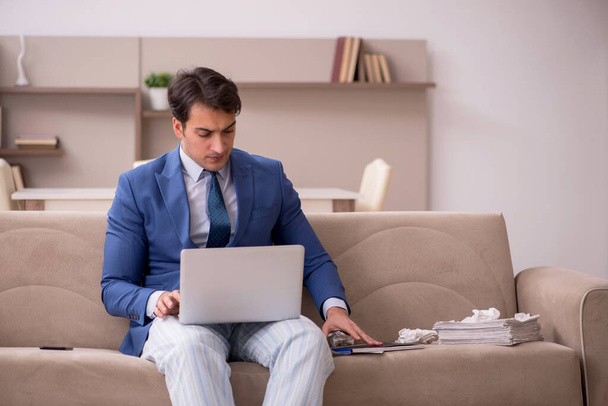 Young businessman employee working from home during pandemic - Photo, Image