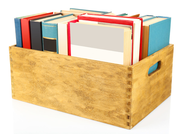 Books in wooden box, closeup - 写真・画像