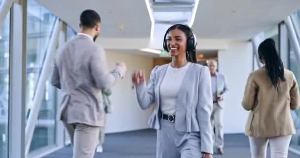 Headphones, music and business woman in office walking with celebration and dancing. Company, female worker and web radio listening to audio feeling happy with freedom and hearing song with a smile. - Footage, Video