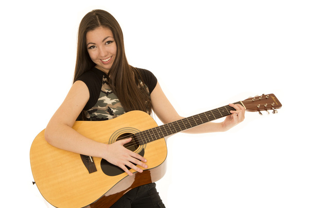 Asian American female playing an acoustic guitar smiling - Fotoğraf, Görsel