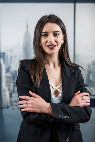 attractive caucasian young business woman manager in suit posign alone at modern ofiice hall.  Corporate worker - Photo, Image