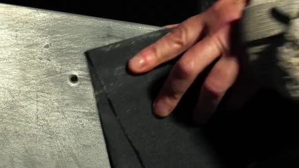 Sanding surface with sandpaper close up slow motion zoom selective focus - Footage, Video