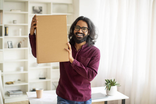 Delivery Concept. Excited Young Indian Man Embracing Big Delivered Box At Home, Cheerful Millennial Eastern Man Holding Parcel With Ordered Items, Emotionally Reacting To Fast Shipping, Copy Space - Photo, Image