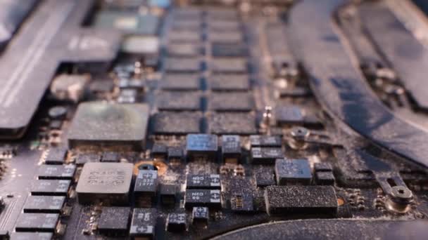 Kyiv, Ukraine - August 17, 2023: MacBook Pro Retina, 15-inch, Late 2013 motherboard in dust, close-up. Smooth camera movement inside a dirty laptop. High quality FullHD footage - Footage, Video