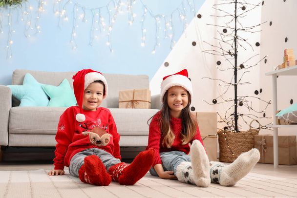 Adorable little children wearing Christmas socks at home - Photo, Image