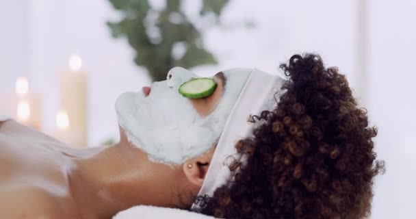 Woman, spa and skincare or face mask, peace and stress free for wellness, cosmetics and resort. Black person, peeling and dermatology for healthy skin, self care and mud or natural, organic and detox. - Footage, Video