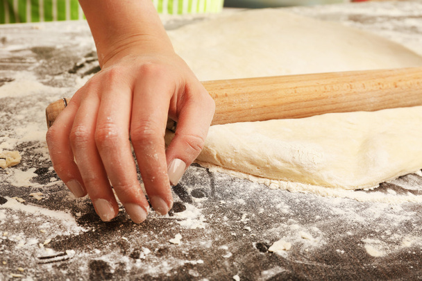 Making dough by female hands on wooden table background - Fotoğraf, Görsel