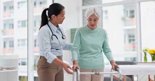Rehabilitation, walker or doctor walking with old woman in retirement or hospital for wellness or support. Physio, nurse helping or elderly patient learning with frame in physical therapy recovery. - Footage, Video