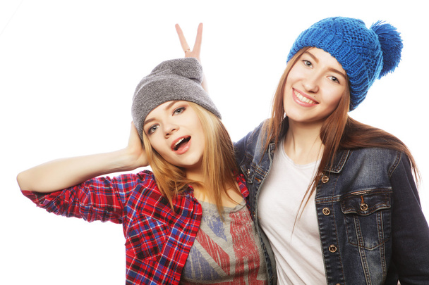 Two young girl friends  having fun. - Фото, изображение