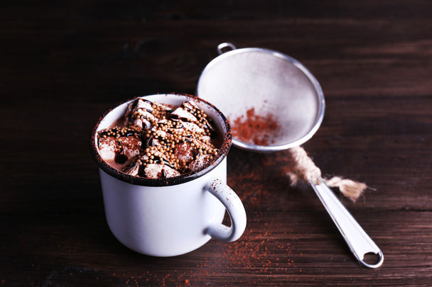 Mug of cocoa with marshmallows on wooden background - Foto, afbeelding