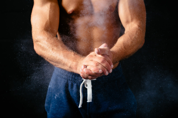 Muscular torso and hands - Foto, afbeelding