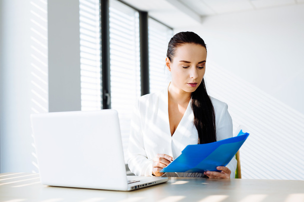Woman professional looking at some files - Photo, Image