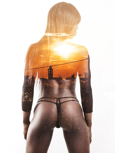 Double exposure of back model portrait and cityscape sunset - Valokuva, kuva