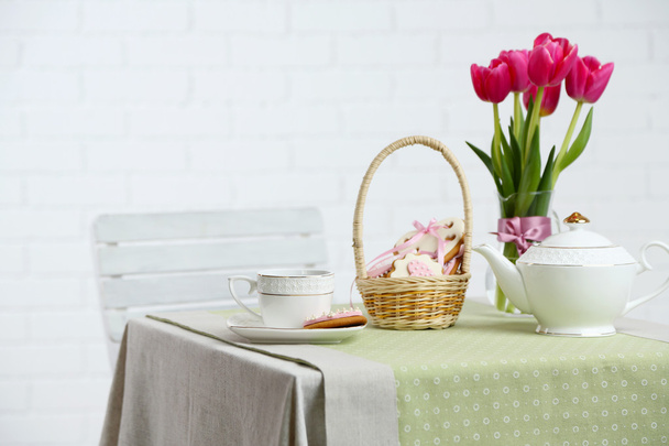 Tea set with flowers on table, on light background - Zdjęcie, obraz