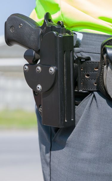 politieagent met het pistool - Foto, afbeelding