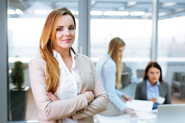 Female manager standing in office - Foto, imagen