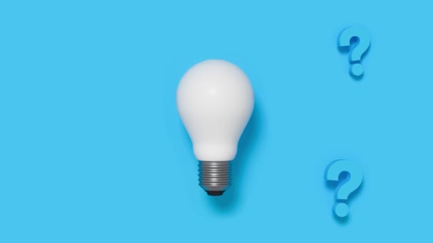 Light bulb with question mark on blue pattern background. 4K motion video. - Footage, Video