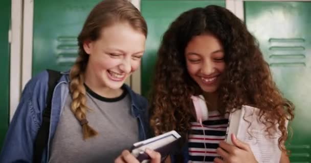 Locker, laugh and friends in school for learning, studying and knowledge in hallway. Education, teenager and happy young female students with textbooks, talking and speaking in academy corridor. - Footage, Video