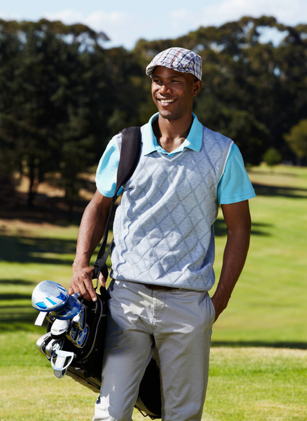Black man, golf course and happiness in summer for fun game or practice outdoors. Smiling, metal equipment and clubs for professional training with an african male person on grass for sports. - Photo, Image
