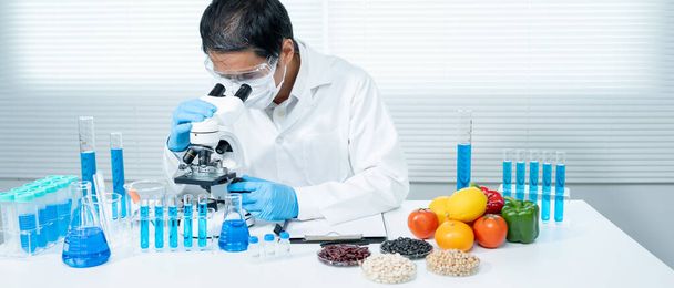 Scientist check chemical food residues in laboratory. Control experts inspect the concentration of chemical residues. hazards, ROHs standard, find prohibited substances, contaminate, Microbiologist - Zdjęcie, obraz