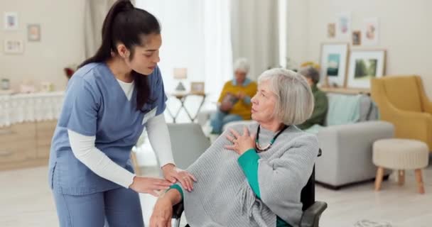 Nurse, physiotherapy and senior woman in wheelchair, back pain check and physical therapy exam at home. Retirement nursing, physiotherapist medical doctor and elderly patient with disability support. - Video