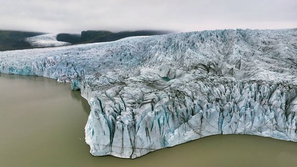 Aerial view of white glacier. Epic Drone Shot iceberg in national park in Iceland. - Photo, Image