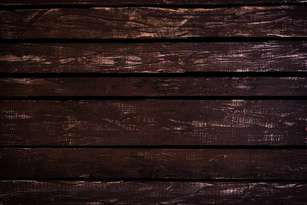 Dark brown wooden background. - Photo, Image