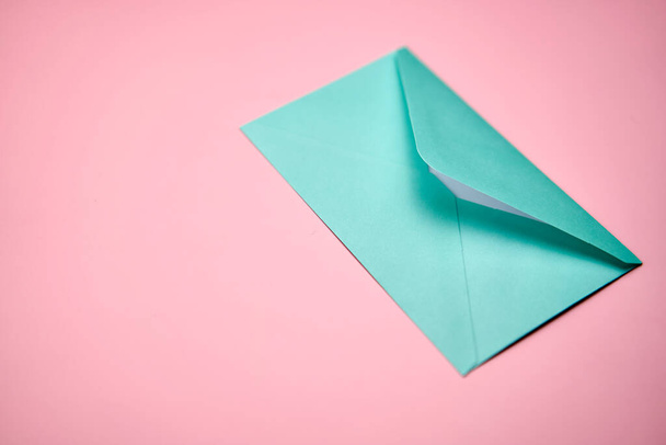 Blue love letter on a pink background. - Photo, Image