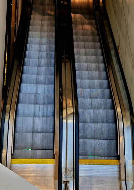 escalator and travelator service and adjustment. lubrication and regular review of the operation of the safety switches that stop machine in an emergency. when people fall, metal front view, stripes - Photo, Image