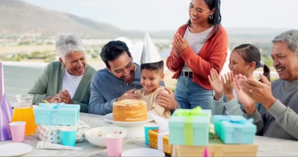 Happy family, birthday and applause for cake, party or love for son, grandparents and parents at celebration. Men, women and young children with hug, bonding and present for event at house on holiday. - Footage, Video