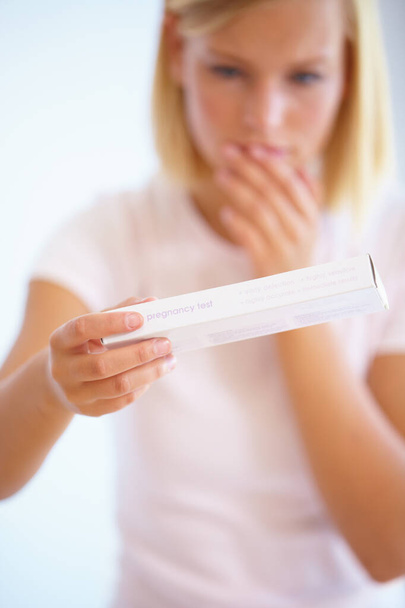 Anxiety, shock and woman with pregnancy test in bathroom waiting for results, news and surprise. Motherhood, pregnant and worried person with medical testing kit for fertility or ovulation at home. - Photo, Image