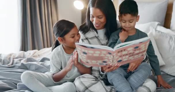 Bed, mother and children reading, education and home with happiness, creativity and fantasy. Female parent, mama and mom with kids, bedroom and storytelling with quality time together and learning. - Footage, Video