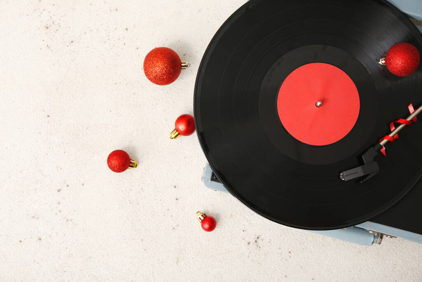 Christmas music concept with vinyl record player and decorations on white grunge background - Photo, Image